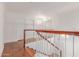 Upstairs hallway featuring wood floors, white walls, and natural light at 1723 W Mercury Way, Chandler, AZ 85224