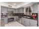 Kitchen features granite counters, stainless steel appliances, ample counter space, and cabinetry at 1723 W Mercury Way, Chandler, AZ 85224