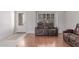 Cozy living area with wood floors, decorative doorway, and a decorative front door at 1723 W Mercury Way, Chandler, AZ 85224