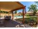Covered patio with outdoor seating, garden, and view of the swimming pool at 1723 W Mercury Way, Chandler, AZ 85224