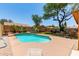 Back yard features a private pool with grass, lounge chairs, and patio with seating at 1723 W Mercury Way, Chandler, AZ 85224