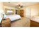 Inviting bedroom with light walls, tiled floors, and a ceiling fan at 17371 N 86Th Ave, Peoria, AZ 85382