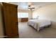 Bright bedroom with neutral colors and tiled floors at 17371 N 86Th Ave, Peoria, AZ 85382