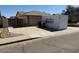 View of home exterior with large PODS storage container in the driveway at 17371 N 86Th Ave, Peoria, AZ 85382