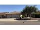 Charming single-story home featuring a three-car garage and mature landscaping at 17371 N 86Th Ave, Peoria, AZ 85382