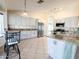 Spacious kitchen featuring stainless steel appliances, granite countertops, and tiled floors at 17371 N 86Th Ave, Peoria, AZ 85382