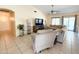 Cozy living room featuring tile floors, ceiling fan, and comfortable seating at 17371 N 86Th Ave, Peoria, AZ 85382