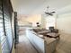 Open concept floor plan with living room flowing into kitchen with white cabinetry at 17371 N 86Th Ave, Peoria, AZ 85382