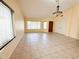 Spacious living room featuring tile floors, neutral walls and lots of natural light at 17371 N 86Th Ave, Peoria, AZ 85382