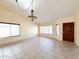 Open living room featuring tile flooring, windows, and front door at 17371 N 86Th Ave, Peoria, AZ 85382