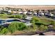 Aerial view showcasing a park, playground, and the surrounding neighborhood at 17851 N Mughetto Dr, Maricopa, AZ 85138