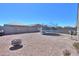 Private backyard featuring hardscaped gravel, trampoline, and secure block fencing at 17851 N Mughetto Dr, Maricopa, AZ 85138