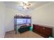 Bedroom featuring carpet, a ceiling fan, and a bunk bed with seating area at 17851 N Mughetto Dr, Maricopa, AZ 85138