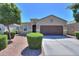 This home features manicured landscaping, a two-car garage, and a welcoming entrance, exuding suburban charm at 17851 N Mughetto Dr, Maricopa, AZ 85138
