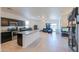 Open-concept kitchen featuring stainless steel appliances, a large island, and modern fixtures, ideal for entertaining at 17851 N Mughetto Dr, Maricopa, AZ 85138