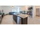 This expansive kitchen island with granite countertops, modern appliances, and ample storage is an entertainer's dream at 17851 N Mughetto Dr, Maricopa, AZ 85138