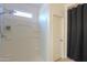 Shower with multiple shelves for toiletries and a small window at 17851 N Mughetto Dr, Maricopa, AZ 85138