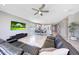 Open-concept living room with a seamless view of the kitchen and dining area, creating a spacious and inviting atmosphere at 18000 W Thistle Landing Dr, Goodyear, AZ 85338