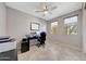 Bright home office with natural light, workspace, and desk at 18000 W Thistle Landing Dr, Goodyear, AZ 85338