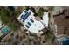This is an aerial view of a luxury home with solar panels, pool, green space, and outdoor entertainment at 18425 W Santa Irene Dr, Goodyear, AZ 85338
