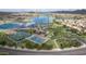 Aerial view of a community park with tennis courts, basketball court, walking paths, and playground at 18425 W Santa Irene Dr, Goodyear, AZ 85338