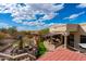 A beautiful home with water features and lush turf creating an oasis-like backyard at 18425 W Santa Irene Dr, Goodyear, AZ 85338