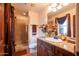 Bathroom with a marble counter and separate glass shower at 18425 W Santa Irene Dr, Goodyear, AZ 85338