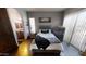 Cozy bedroom with a black bed and sleek dresser at 18425 W Santa Irene Dr, Goodyear, AZ 85338