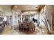 Luxurious dining room featuring elegant furnishings, decorative columns, and plenty of natural light at 18425 W Santa Irene Dr, Goodyear, AZ 85338