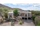 An exterior aerial view of a beautiful luxury home with a three-car garage at 18425 W Santa Irene Dr, Goodyear, AZ 85338