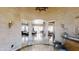 Elegant foyer showcasing decorative columns, tile floors, and an open view of the dining and living area at 18425 W Santa Irene Dr, Goodyear, AZ 85338