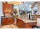 Close-up of the kitchen sink and countertop area with stainless steel appliances and custom cabinetry at 18425 W Santa Irene Dr, Goodyear, AZ 85338