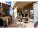 An outdoor kitchen and covered patio create a relaxing and enjoyable outdoor living space at 18425 W Santa Irene Dr, Goodyear, AZ 85338
