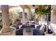 A comfortable covered patio with stucco columns offers an inviting space to relax outdoors at 18425 W Santa Irene Dr, Goodyear, AZ 85338