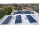 Close up aerial view of the roof with solar panels on a single Gathering home at 18425 W Santa Irene Dr, Goodyear, AZ 85338