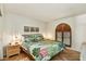 Bright bedroom featuring a king bed, modern furnishings, and stylish decor with a colorful bedspread at 19025 N 96Th Ave, Peoria, AZ 85382