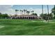 Golf course clubhouse featuring manicured greens, desert landscape, and a picturesque setting at 19025 N 96Th Ave, Peoria, AZ 85382