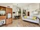 Spacious living room with stylish furniture, wood floors, and seamless flow to the dining area at 19025 N 96Th Ave, Peoria, AZ 85382