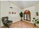 Comfortable office with chair, decor, unique herringbone floor, and plenty of natural light at 19025 N 96Th Ave, Peoria, AZ 85382