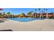 Community pool with lap lanes, lounge chairs, and shaded seating areas at 19025 N 96Th Ave, Peoria, AZ 85382