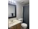 Bathroom with neutral colors, sink, mirror and toilet at 1920 W Lindner Ave # 222, Mesa, AZ 85202