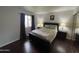 Well-lit main bedroom with hard wood floors and closet space at 1920 W Lindner Ave # 222, Mesa, AZ 85202