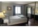 Bright bedroom featuring wood floors, mirrored closet, and cozy natural lighting at 1920 W Lindner Ave # 222, Mesa, AZ 85202