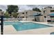 Community pool area with lounging chairs and shade, perfect for relaxation and socializing at 1920 W Lindner Ave # 222, Mesa, AZ 85202