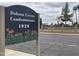 Dobson Greens Condominiums with cacti and sign with year 1920 at 1920 W Lindner Ave # 222, Mesa, AZ 85202