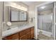 Bathroom featuring vanity with modern sink, lighting and sliding glass shower at 1941 S Pierpont Dr # 2015, Mesa, AZ 85206