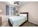 Comfortable bedroom with a ceiling fan, window with blinds, and carpeted floor at 1941 S Pierpont Dr # 2015, Mesa, AZ 85206