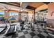 A modern gym offers various equipment, including treadmills and weight machines, for residents' fitness at 1941 S Pierpont Dr # 2015, Mesa, AZ 85206