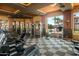 Bright gym space features multiple machines and free weights offering a comprehensive workout area at 1941 S Pierpont Dr # 2015, Mesa, AZ 85206