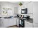 Bright kitchen area with stainless steel appliances, white cabinets and modern design at 1941 S Pierpont Dr # 2015, Mesa, AZ 85206